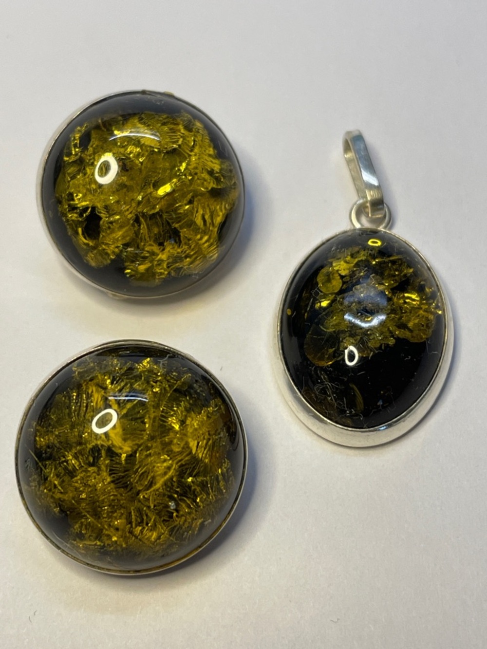Olive Green Amber Cabochon Pendant and matching clip earrings set in silver